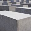 a group of cement blocks sitting on top of a sidewalk